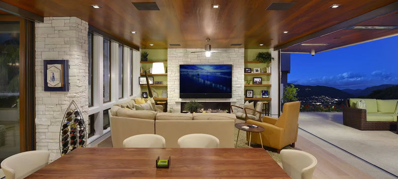 Seamless Harmony: Blending Interior and Outdoor Living Spaces with Stone, Steel and Window Walls